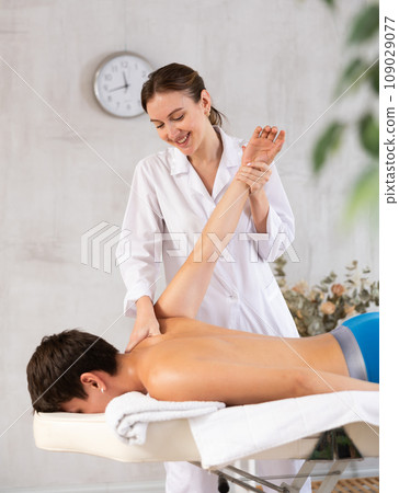 Physical therapy for young man Physical therapy for young man 109029077