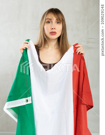 Young sad pretty woman displaying flag of italy Young sad pretty woman displaying flag of italy 109029148