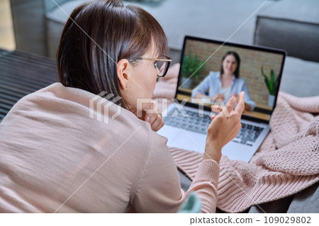 Online mental therapy, remote meeting of middle aged woman with psychologist Online mental therapy, remote meeting of middle aged woman with psychologist 109029802