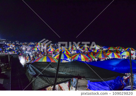 Colorful umbrellas of selling shops at the beach market of Puri city a renowned city,beach resort in the beach of Bay of Bengal, Odisha, India, very popular in eastern coast of India. FEBRUARY 2020. 109029820
