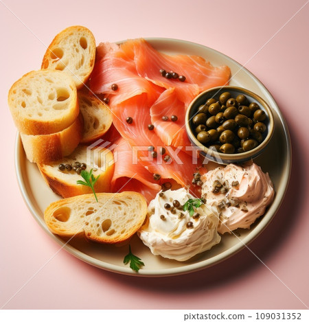 A plate of smoked salmon, cream cheese, and bagel with capers and red onion 109031352