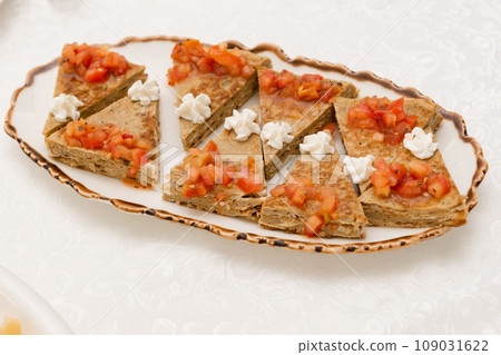 Liver cake is cut into triangles and served on the table. Liver cake is cut into triangles and served on the table. 109031622
