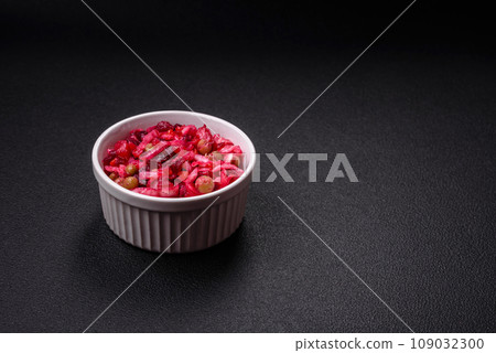 Delicious juicy vinigret salad of boiled vegetables potatoes, beets, pot, cabbage and carrots 109032300