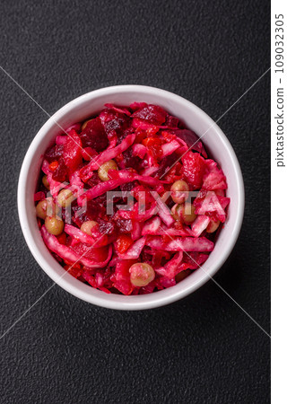 Delicious juicy vinigret salad of boiled vegetables potatoes, beets, pot, cabbage and carrots 109032305