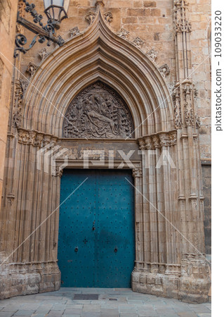 View of the old and beautiful art iron blue color door with door knocker, classic architectural detail in Barcelona, Spain. View of the old and beautiful art iron blue color door with door knocker, classic architectural detail in Barcelona, Spain. 109033220