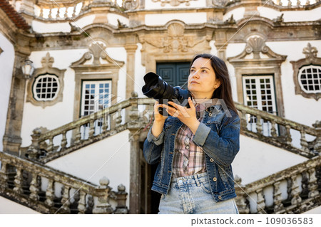 Traveler woman with camera taking pictures of Mateus Palace, Vila Real 109036583