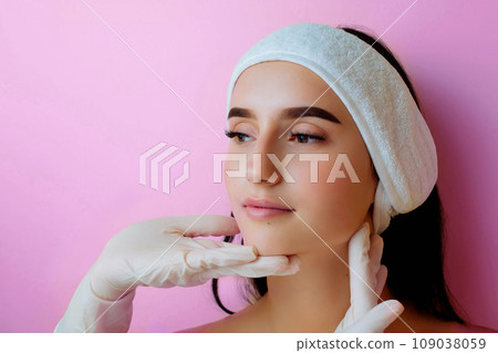 Caring for the skin. Cosmetic cream on a woman's face. Spa beauty treatments. Facial care Caring for the skin. Cosmetic cream on a woman's face. Spa beauty treatments. Facial care 109038059
