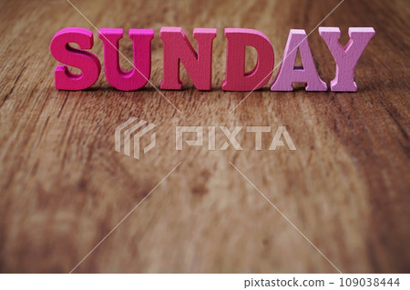 sunday alphabet letter with space copy on wooden background 109038444
