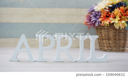 April alphabet letters and flower with space for copy on wooden background April alphabet letters and flower with space for copy on wooden background 109040632
