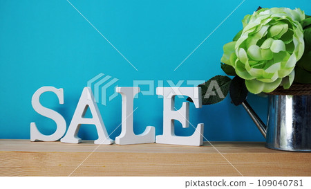 Sale alphabet letters with space for copy on blue background Sale alphabet letters with space for copy on blue background 109040781