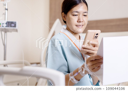 Sick woman using mobile phone scan qr codes to connect a doctor to health Information 109044106