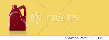canisters of lubricating oil or motor oil on yellow background 109044499