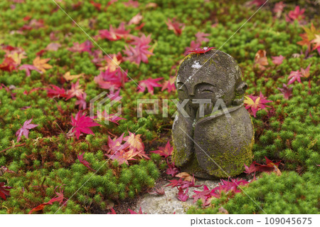 Kyoto, Enkoji Temple, a child Jizo with a maple leaf on its head 109045675