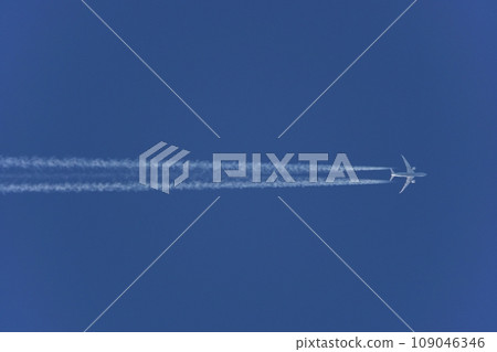 Jet plane and contrail flying in the evening sky, Spring, Telephoto, Sky only, 230417pm 109046346