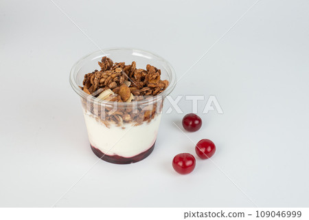 Complete meal contained in this cup of yogurt, blueberries, strawberries, and granola for plenty of protein and carbohydrates to eat. 109046999