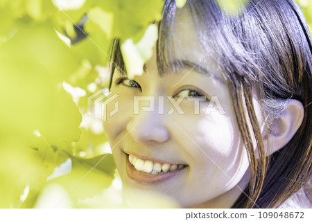 Autumn leaves and a young lady 109048672
