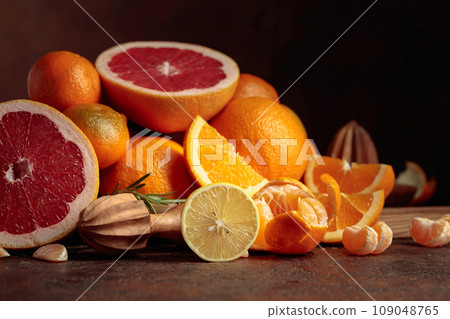 Citrus fruits on a old brown table. 109048765
