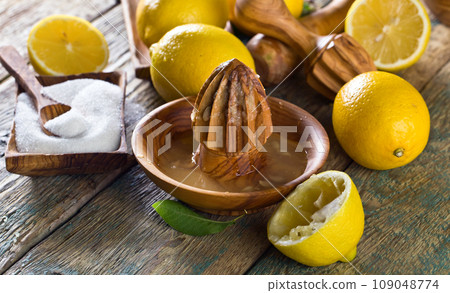 Lemons and squeezer . Lemons and squeezer . 109048774