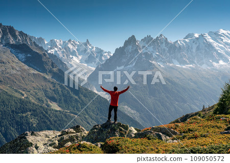 A male hiker standing with enjoying the Mont Blanc mountain range view during trail in Lac Blanc at France 109050572