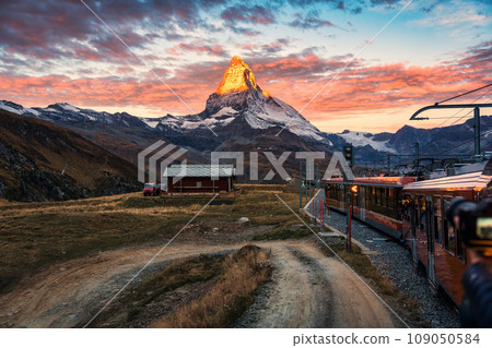 View of sunrise on Matterhorn mountain during the train ride up to Gornergrat at Zermatt, Switzerland 109050584