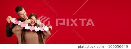 against red studio background. Valentine's day, relationship 109050649