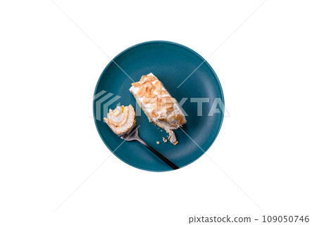 A piece of delicious sweet meringue roll with mascarpone cheese, berries and almonds A piece of delicious sweet meringue roll with mascarpone cheese, berries and almonds 109050746