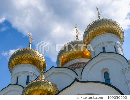 Domes of the Assumption Cathedral in Yaroslavl against the blue sky Domes of the Assumption Cathedral in Yaroslavl against the blue sky 109050900