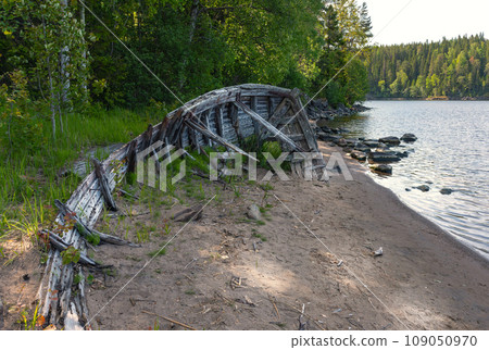 The remains of an old wooden boat on the shore of Valaam Island The remains of an old wooden boat on the shore of Valaam Island 109050970