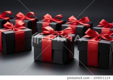 Red Gift Boxes with Black Ribbon and Bow on Black Background. Black Friday Concept Red Gift Boxes with Black Ribbon and Bow on Black Background. Black Friday Concept 109051124