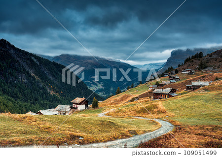 Matterhorn iconic mountain and small village of wooden huts on the hill at Zermatt, Switzerland Matterhorn iconic mountain and small village of wooden huts on the hill at Zermatt, Switzerland 109051499