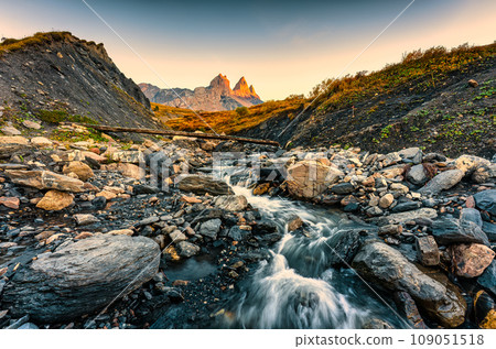 Landscape of iconic three peak and waterfall flowing of Aiguilles dArves in French alps at Savoie, France Landscape of iconic three peak and waterfall flowing of Aiguilles dArves in French alps at Savoie, France 109051518