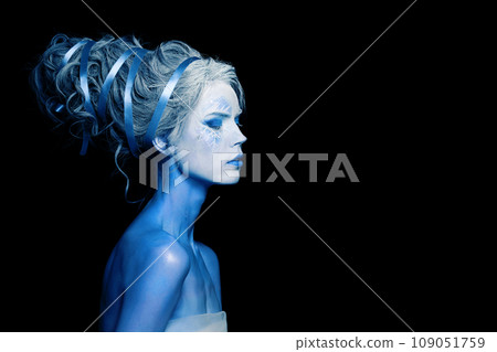 Perfect cool woman with blue and white body art, carnival makeup and hairstyle Perfect cool woman with blue and white body art, carnival makeup and hairstyle 109051759