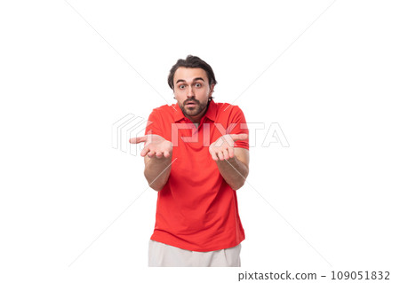 a young confused caucasian brunette man with a well-groomed beard is trying to understand looking at a young confused caucasian brunette man with a well-groomed beard is trying to understand looking at 109051832