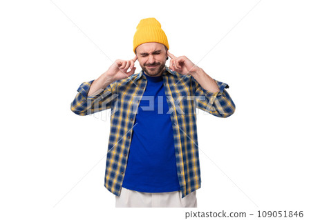 young smart caucasian brunette handsome man with a well-groomed beard and mustache in a plaid shirt young smart caucasian brunette handsome man with a well-groomed beard and mustache in a plaid shirt 109051846