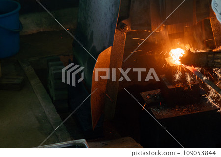 Photographing a blacksmith craftsman forging knives, which are essential tools for all traditional crafts. Photographing a blacksmith craftsman forging knives, which are essential tools for all traditional crafts. 109053844