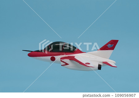 red fighter jet flying in the blue sky red fighter jet flying in the blue sky 109056907
