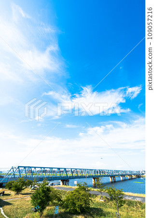 Iron bridge spanning the sky and river Iron bridge spanning the sky and river 109057216