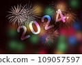2024, Fireworks next to the number 2024 on background of faded lights. Happy New Year 109057597