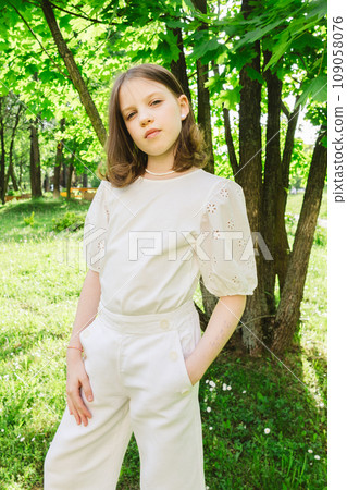 Girl spending time alone at city park in beautiful warm sunny day. Girl spending time alone at city park in beautiful warm sunny day. 109058076
