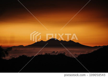 View of mountain with fog at sunset 109058543
