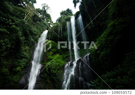 View of jungle waterfall cascade in tropical rainforest View of jungle waterfall cascade in tropical rainforest 109058572