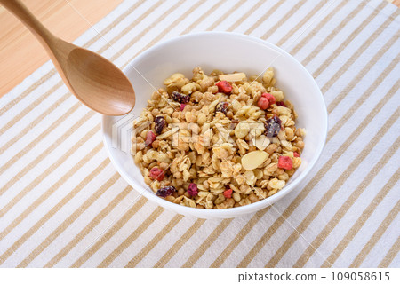Cereal on the placemat, fruit granola, breakfast, health food Cereal on the placemat, fruit granola, breakfast, health food 109058615