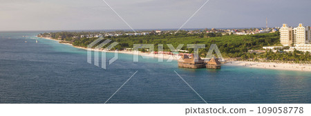 Panorama of coastline at sandy beach ocean and thatch stilt house restaurant at Zanzibar 109058778