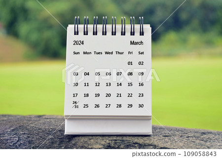 March 2024 white calendar with green blurred background. New year concept. 109058843