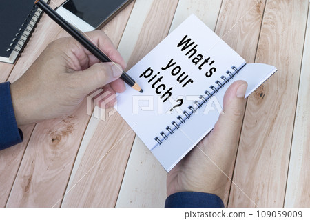 Businessman hands with pen writing notebook on office desk 109059009