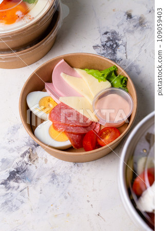 top view of a craft breakfast plate, sausage, tomato, egg and cheese. 109059403