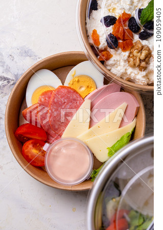 top view of a craft plate with breakfast close-up. Sausage, tomato, egg and cheese. 109059405