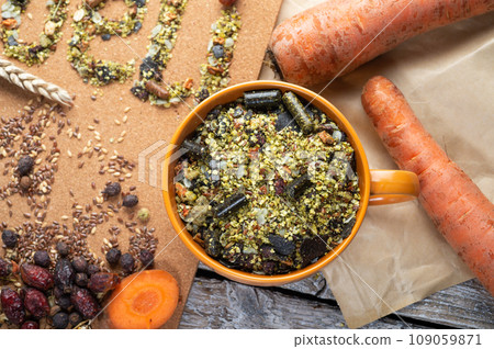 special muesli and granules for sportive horses  served in bowl around muesli background.  feeding and horse care concept. 109059871