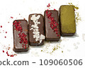 Healthy vegan bars with carob and dried fruits on white background 109060506