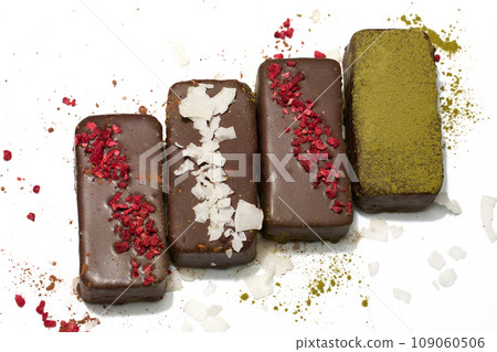 Healthy vegan bars with carob and dried fruits on white background 109060506